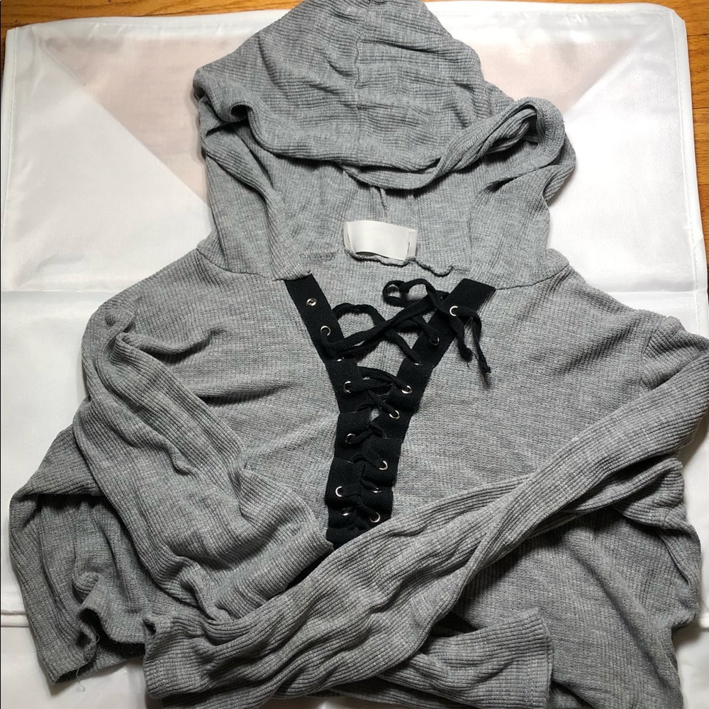 Long sleeve lace up cropped hoodie.